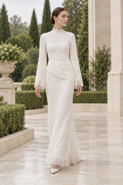 Lilia white long-sleeve lace dress on a model outdoors, showing the high neckline and diagonal hip ruching