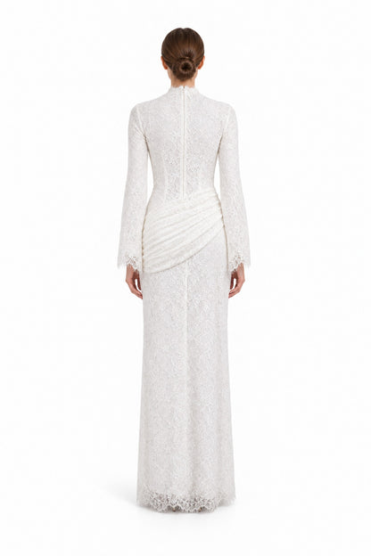 Rear studio view of the Lilia white lace dress, showing the high back, long sleeves and diagonal hip ruching