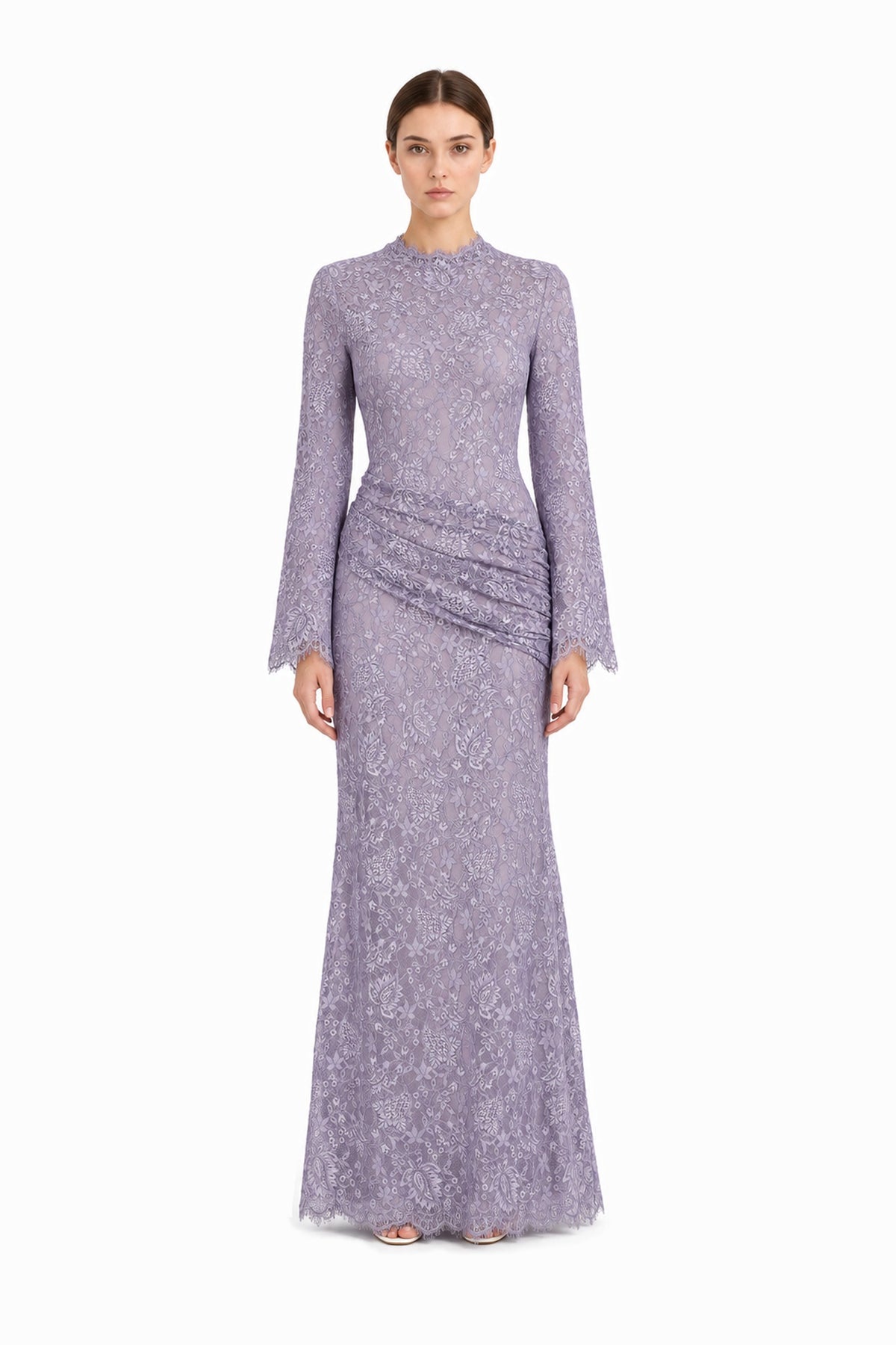 Lilia lilac lace maxi dress on a model, showing long sleeves and the asymmetric waist drape, front studio view.