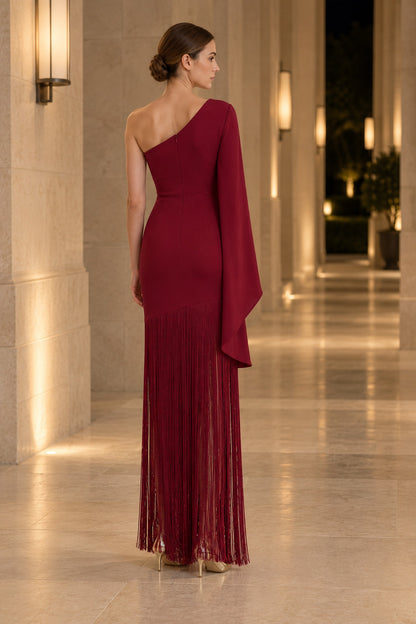 APERLAMIRI Seraphine burgundy one-shoulder cape-sleeve fringe maxi dress — indoor back view